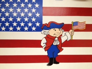 This is a photo of a mural in the Francis Case lobby of our mascot showing Patriot Pride.